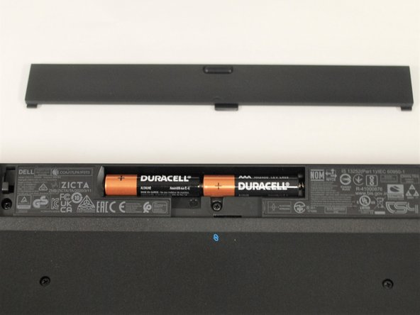 Slide the battery compartment cover back into place.