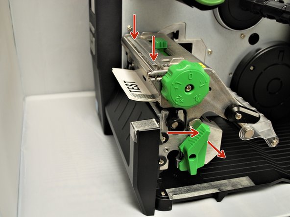 With one hand, press down on the top of the printhead.