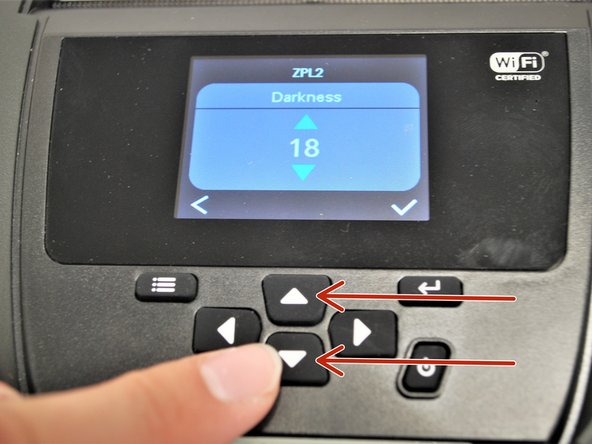 use the arrow keys below the print screen to adjust the darkness.