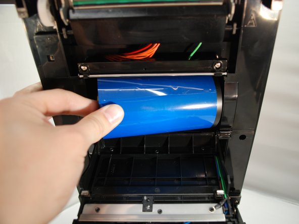 The ribbon spindle should be installed in the BOTTOM  spindle hub.