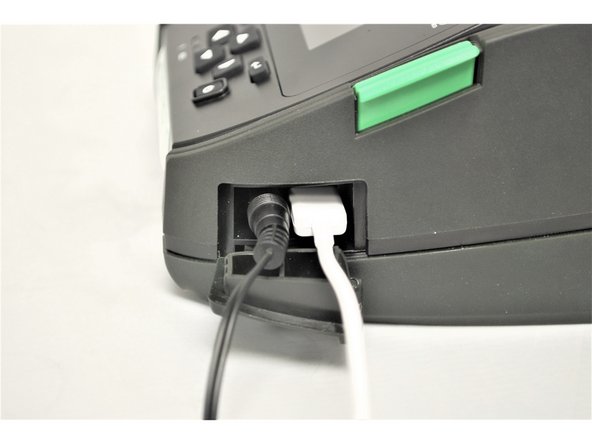 Once the Printer Power Cord is connected, connect the Power Outlet Cord into a power outlet.