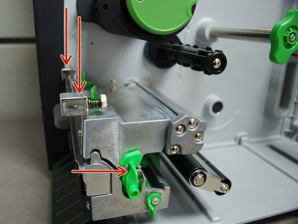 With one hand, press down on the top of the printhead.