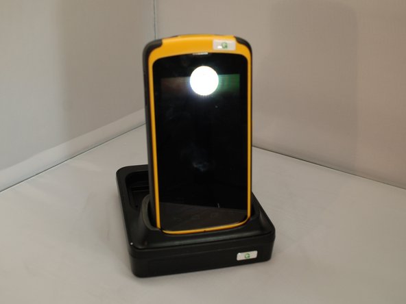 To more easily insert the mobile computer, remove the Velcro strap from the bottom on the back. Follow Guide 2 to remove the strap.