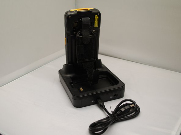 Connect the adapter to the Cradle, and plug the other end into an electrical outlet.