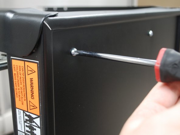 Return to the top of the Cart Top and finish by tightening the bolts with a Phillip's head screwdriver.