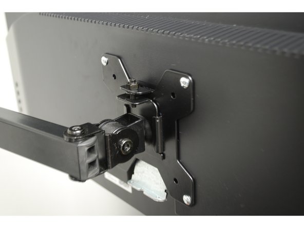 Slide the monitor VESA Plate over the Swivel Arm mount.