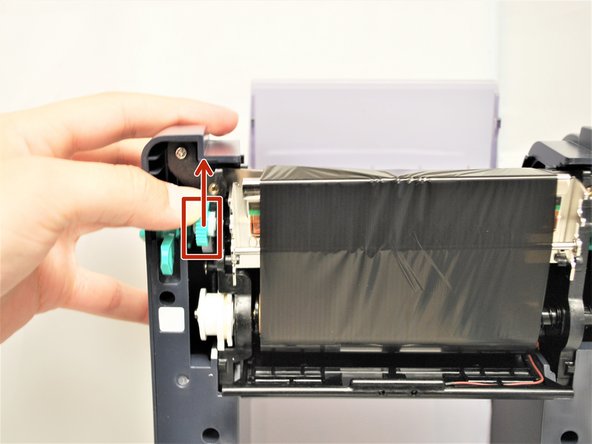 Once the core is secure, use the Ribbon Rewind Gear to remove any slack from the ribbon loaded into the printer