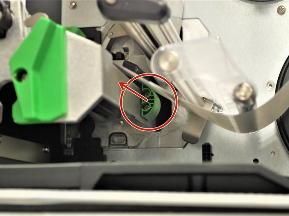 Use the green tab (first picture) underneath the damper roller to adjust the ribbon sensor.
