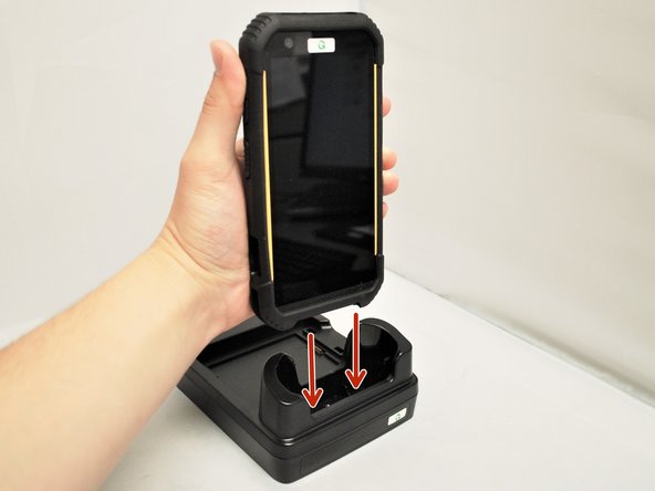 Insert the mobile computer into the Charging Cradle.