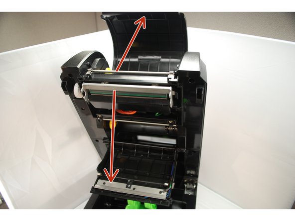 Using medium pressure, pull the top and bottom access covers open.