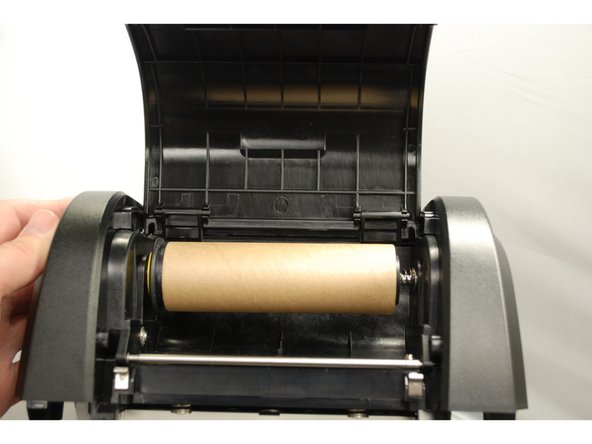 Orient the spindle such that the end with a rim is pointed to the left.