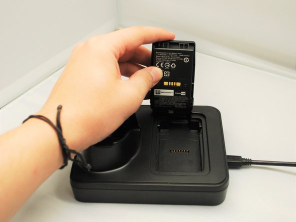 To charge the mobile computer, simply insert the mobile computer into the main charging station and press down.