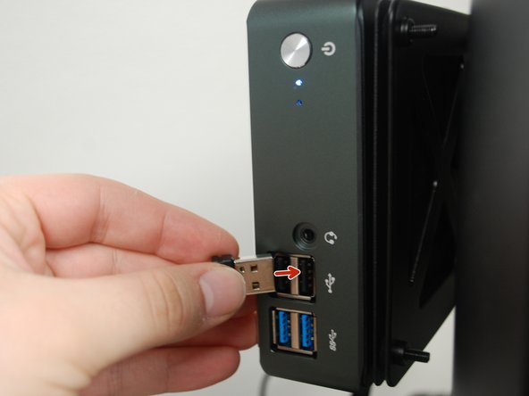 Plug the dongle into a Mini PC USB Port