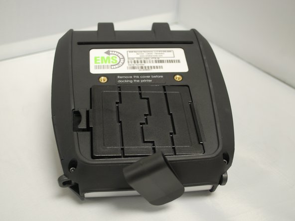 Place the battery back in it's slot, putting in the end without the latch first, then press down firmly on the left side until the latch clicks into place.