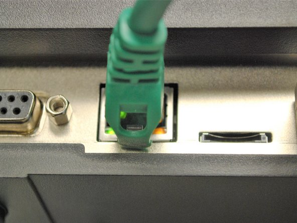 Plug the power cable into the printer then the wall , if it is not already.