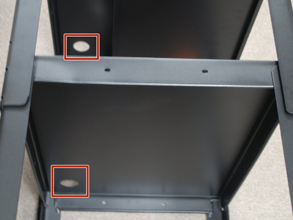 Ensure the two holes on the top and middle shelf align.