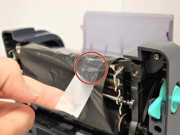 Get a piece of regular tape.