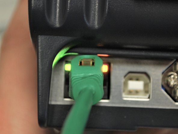 Now that the Ethernet is connected and the Printer has power, two LEDS will light up by the ethernet port.