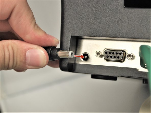 Connect the Printer Power Cord into the back of the printer in the power cord socket.