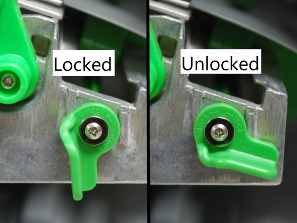 Unlock the media sensor locking lever by twisting it counter-clockwise.