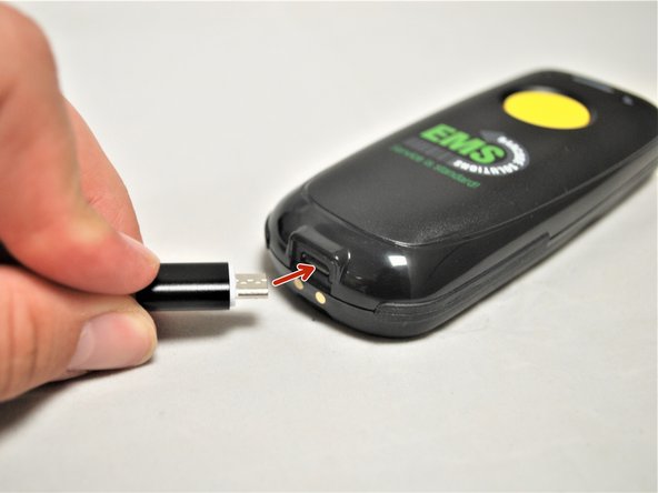 Plug the Micro USB end of the USB Cable into the Bluetooth Scanner