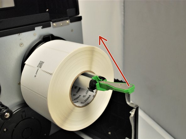 Place the roll of labels on the label supply spindle, so that they unroll from the top