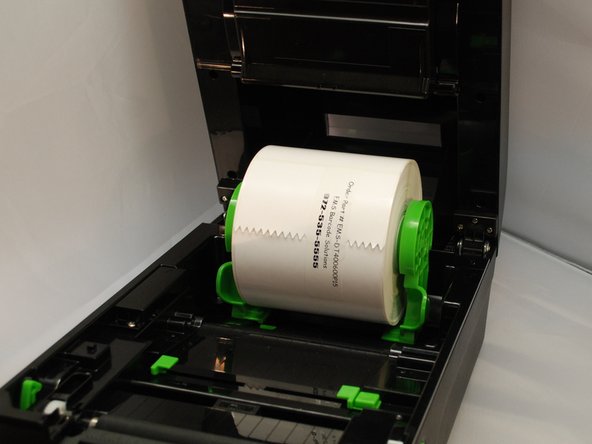 Separate and hold open the green media holders.