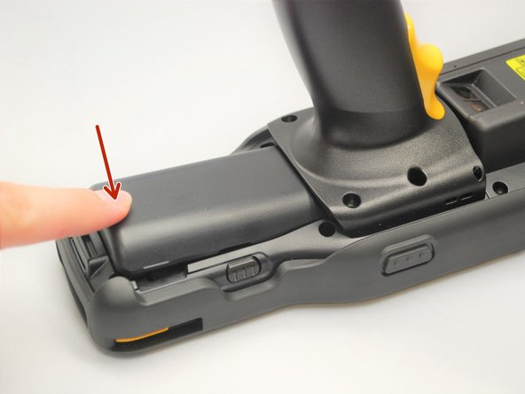 Once the battery pack has slid in all the way, press down on it to lock it in place.