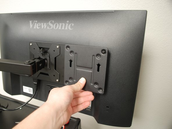 Press the Mounting Plate against the  mounting extension bracket.