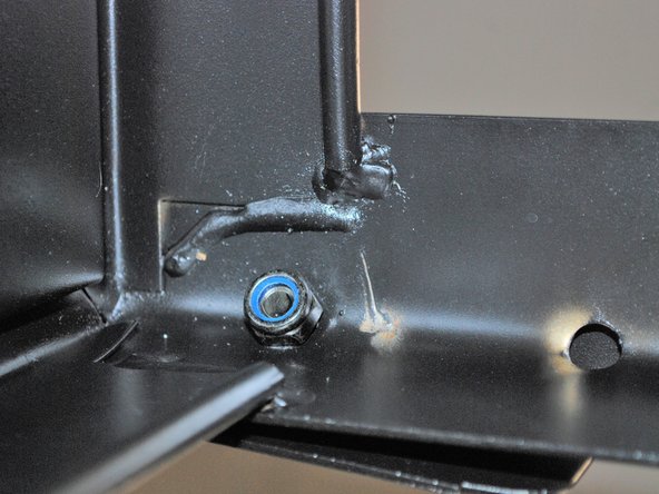 Insert one of the bolts provided with the cart.