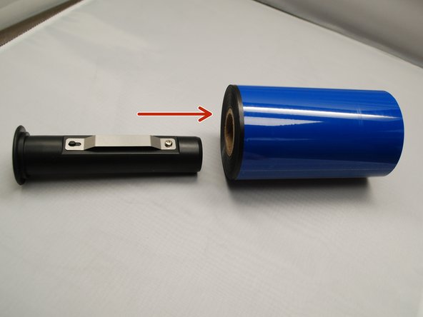 Insert the ribbon spindle into the ribbon core.