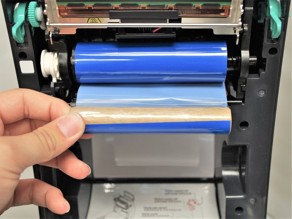 It will unwrap from the bottom, as shown in Image 1.