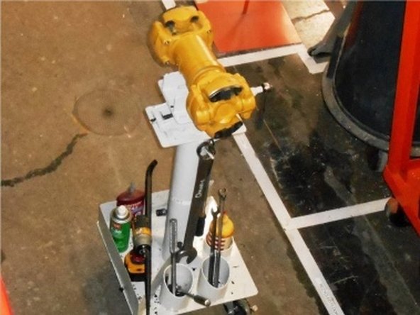 Position drive shaft under crane using rolling fixture