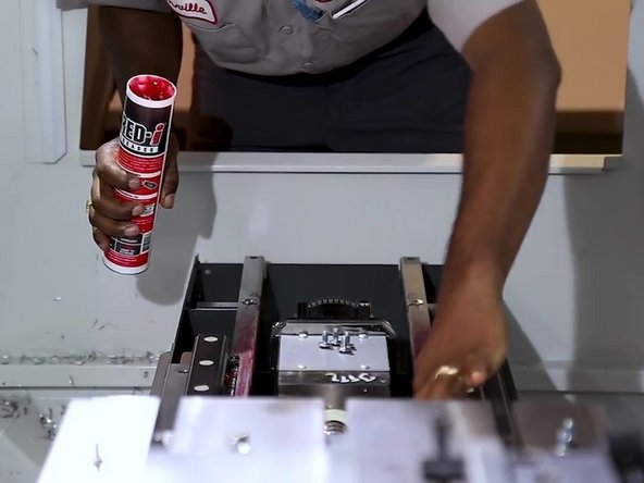 Apply a thin coat of grease to the waycover guide bars