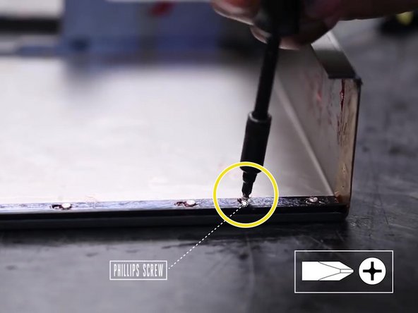 Locate and remove the small philips screw that secures the wiper blade.