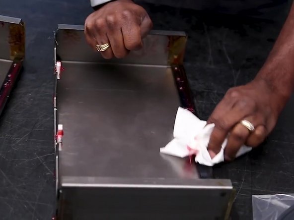 Wipe excess grease from the rubber wiper gaskets.