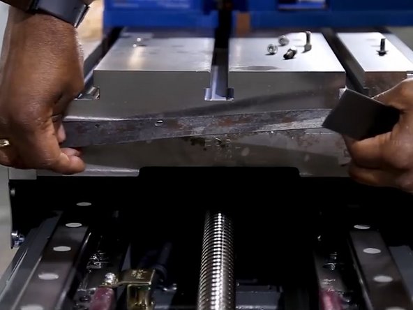 Remove the used gasket and sealant from the table mounting surface.