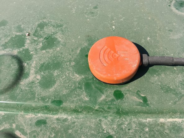 Attach antenna to receiving piece of Velcro.