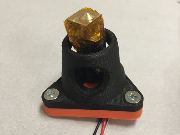 Wrap the J-Head brass heat-block with Kapton tape.  Pay special attention to make sure that the thermistor is properly secured into the thermistor hole, and that it doesn't move around.