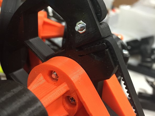 Using the flat-head M3 x 12 screw, and the M3 nut, tighten the belt trap.