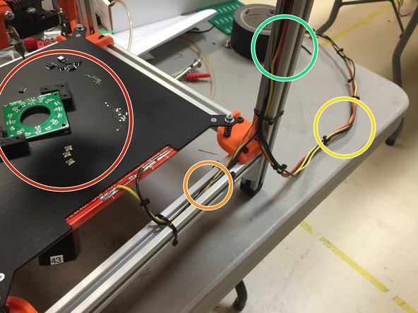 Zip tie the cable to the frame as shown.