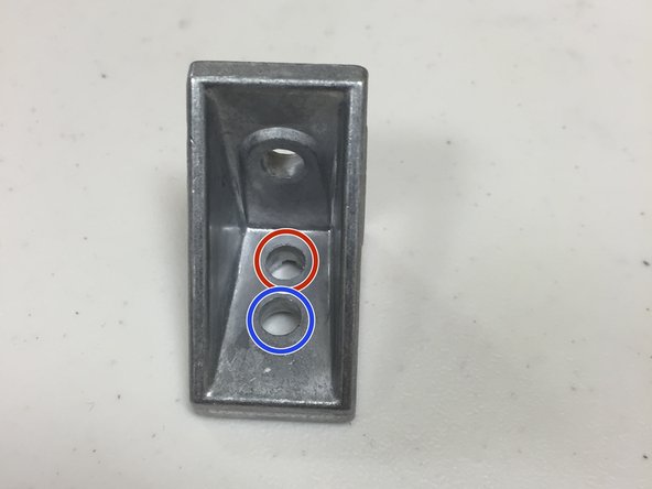 The corner brackets included in the kits have two holes on of the sides.