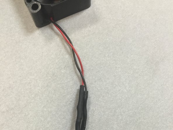 Shrink the heat shrink tubing with a heat gun.