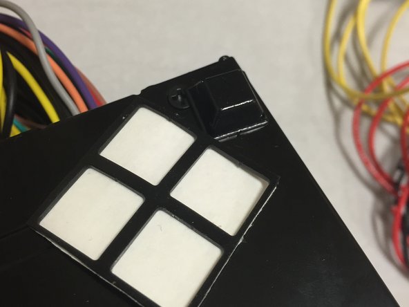 Two on the rear corners of the power supply