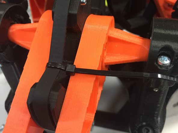 Tighten to tension the belt.  Be careful not to tension too tightly (it will knock the delta mechanism out of alignment, as the PLA / acrylic bends)