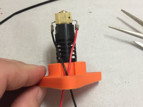 Bend the resistor leads with a pair of needle-nose pliers.  Bend them as shown in the picture.