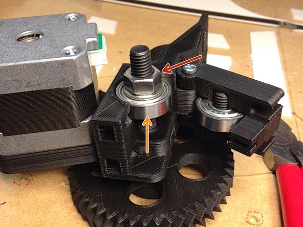 Insert large gear into mounting bracket hole.  You may need to wiggle the gears back and forth to get good alignment.