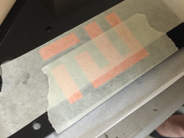 Remove the adhesive backing (carefully, as to not disturb the vinyl), and place the sticker on the lower right corner of the top plate.  Locate it away from any screws or other things attached to the plate.