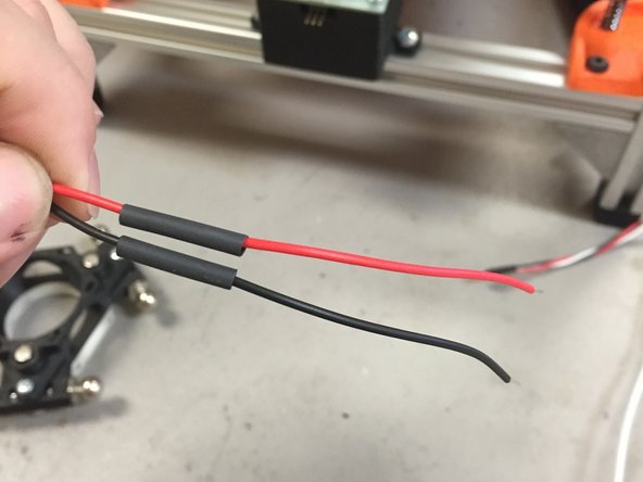 Add a ~20mm long piece of heat shrink tubing to each piece of wire.