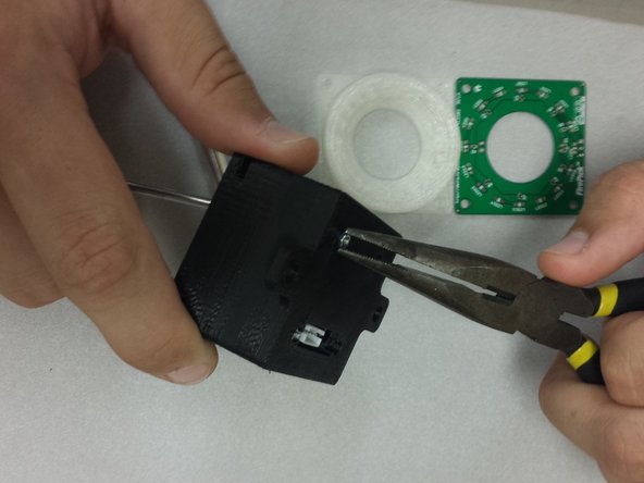 Insert 4x M2 nuts into the back side of the housing.